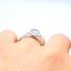 Aquamarine and diamond halo ring