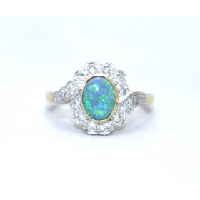 Black opal and diamond cluster ring