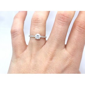 Diamond solitaire with diamond shoulders