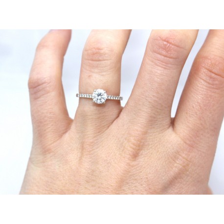 Diamond solitaire with diamond shoulders